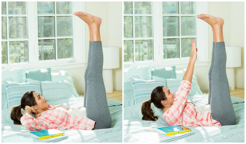 Woman doing leg lifts in bed as part of morning stretching routine